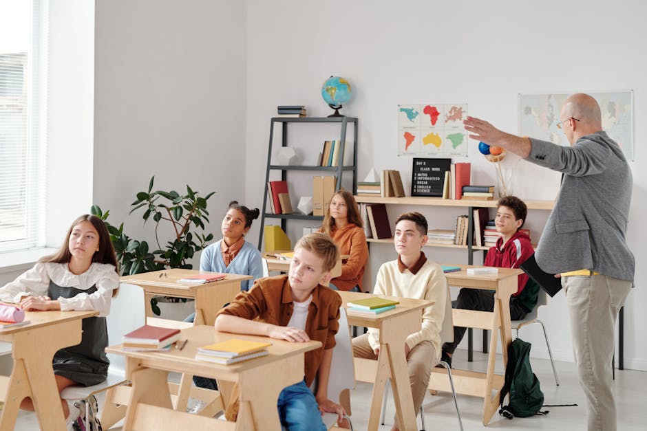 A diverse group of students attentively participating in a classroom lesson led by a teacher