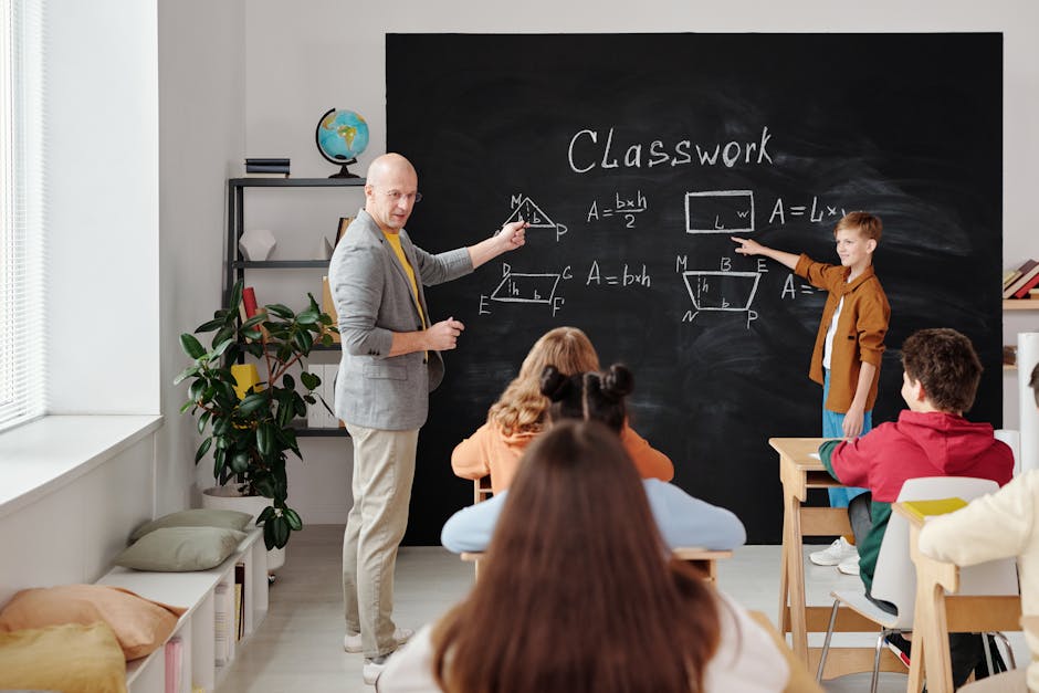 A teacher and students in a classroom during a geometry lesson, focused and engaging
